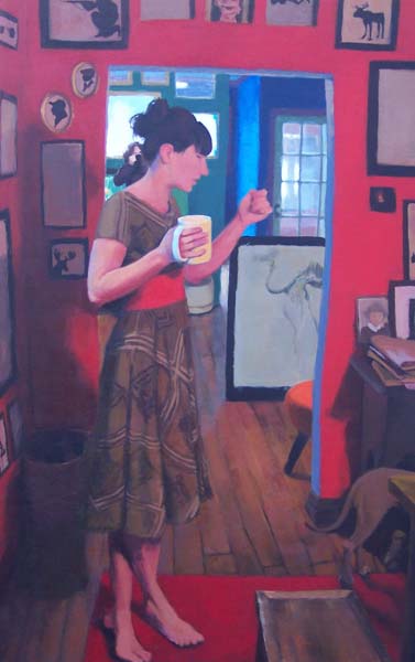 Woman in a dress with a mug in a red room full of paintings
