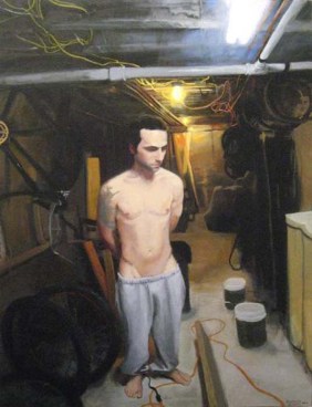 Man in sweatpants and no shirt tied up in the basement