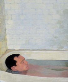 Man relaxed and bathing in a tub