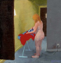 Nude woman ironing clothes ironing clothes in a hallway