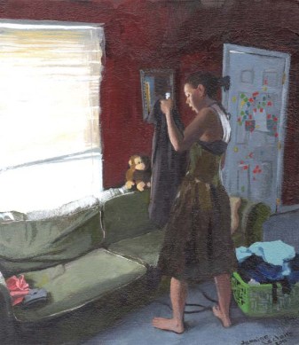 Woman in a Dress Searching a Jacket Next to a Grey Couch