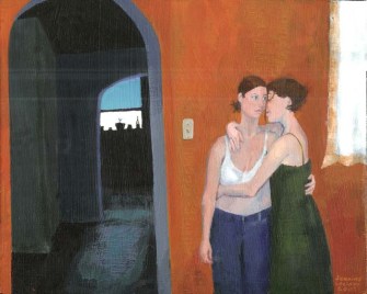 Two women hugging in front of an orange wall
