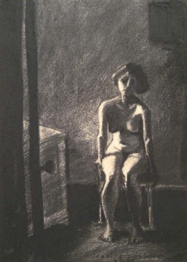 Nude woman sitting on a chair