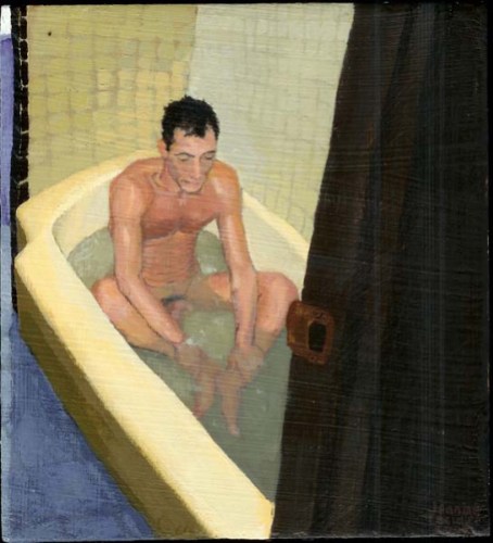 Nude man sitting in a tub