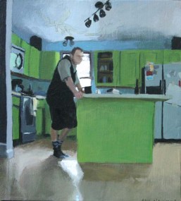 Clothed Man Standing in a Kitchen