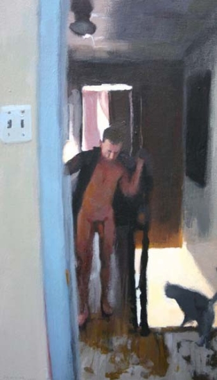 Standing man in a hallway